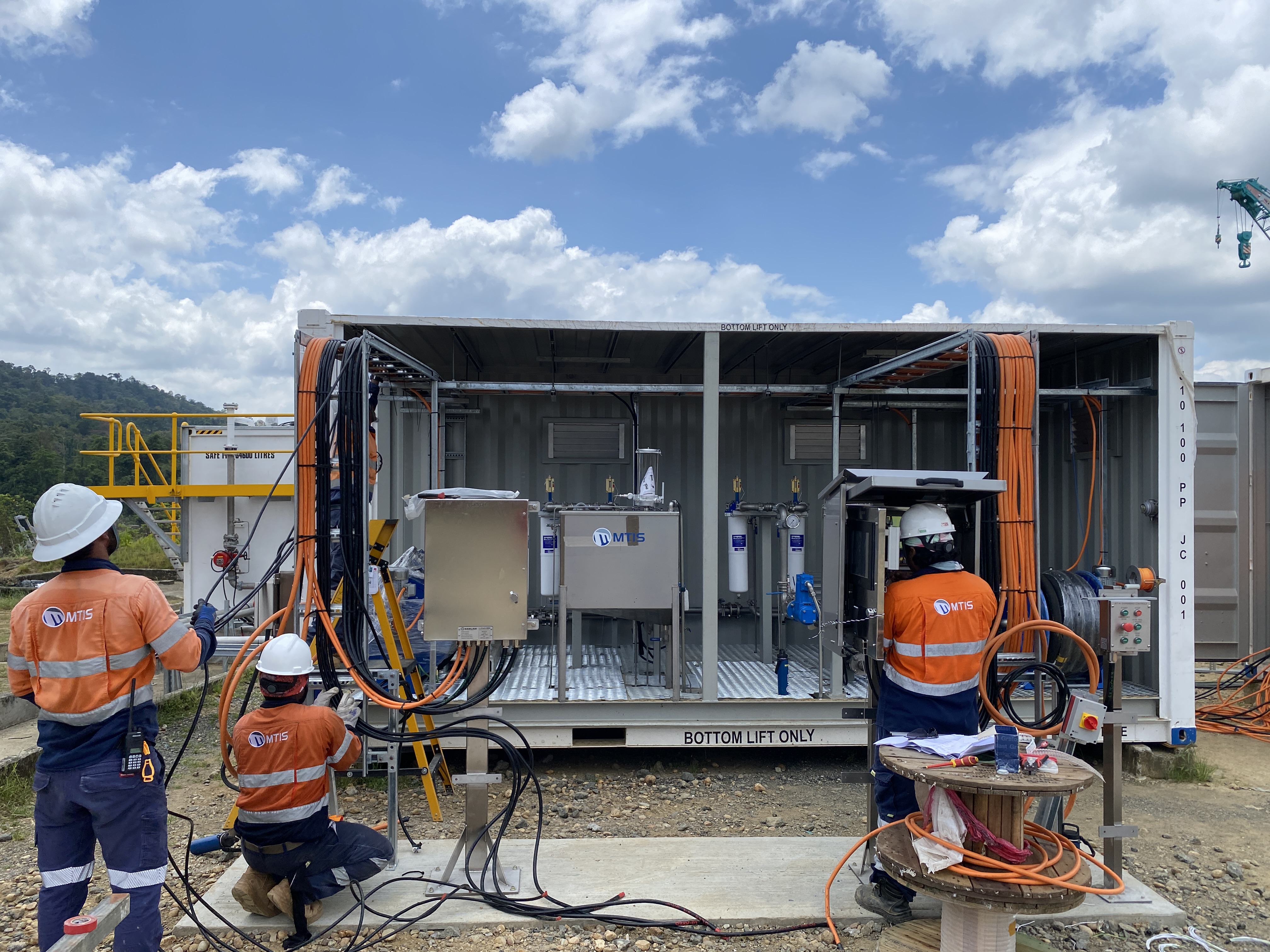 MTIS technicians commissioning the Herd Base bulk fuel facility in Papua New Guinea with fuel infrastructure and control systems installed