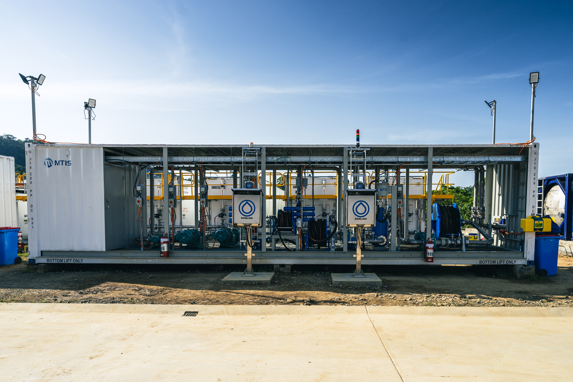 Front elevation of the Herd Base fuel dispensing facility with LV and HV dispensing equipment, hose reels and MTIS containerised modules in Papua New Guinea