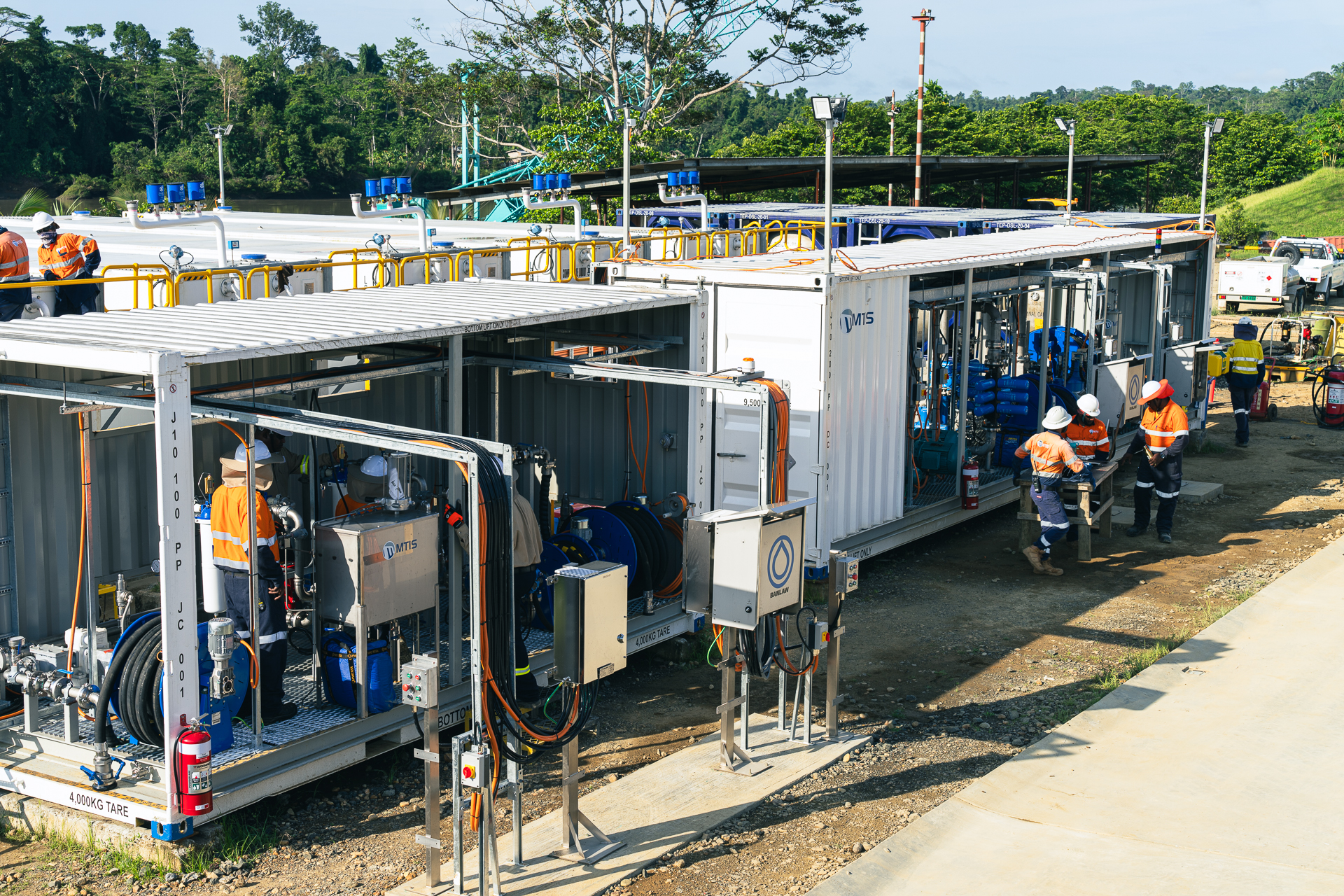 Herd Base fuel facility showing dispensing skids, bulk fuel storage tanks, pipework and MTIS technicians during EPC works in Papua New Guinea