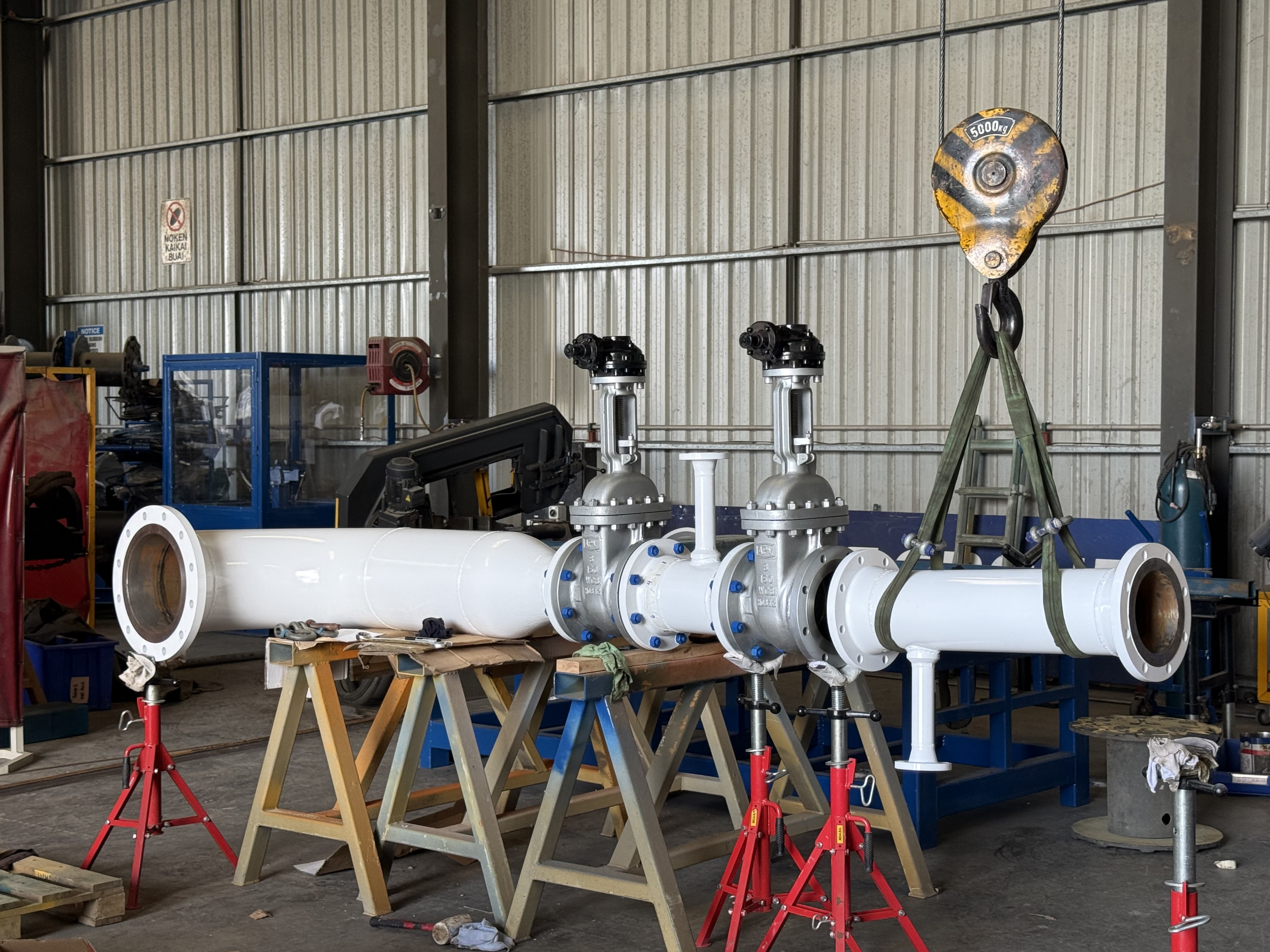Completed MTIS pipe spool assembly in a Port Moresby workshop for a 33-spool fabrication package in PNG