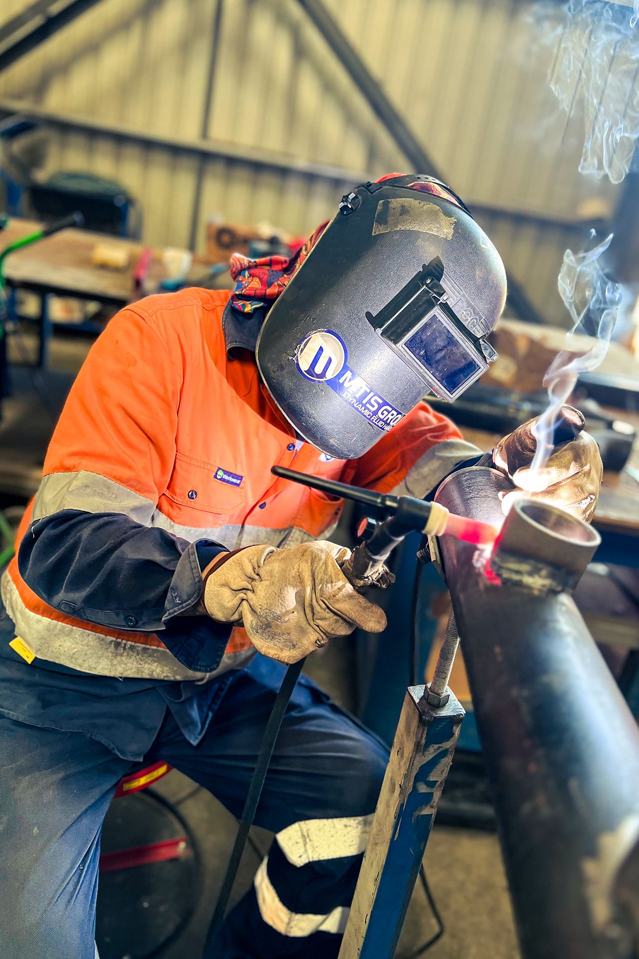 MTIS welder performing coded welding on a pipe spool during fabrication works in Papua New Guinea